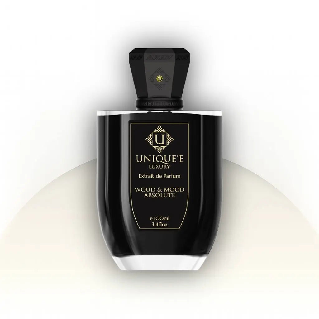 בושם יוקרתי Woud And Mood Absolute Unique’e Luxury יוניסקס 100 מ״ל Extrait de Parfum | זמין גם כדיקנט 10 מ״ל | ניחוח ענברי־עצי עם אוד, עור וזעפרן